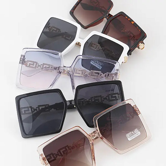 Collection of square sunglasses with different lens colors on a white background