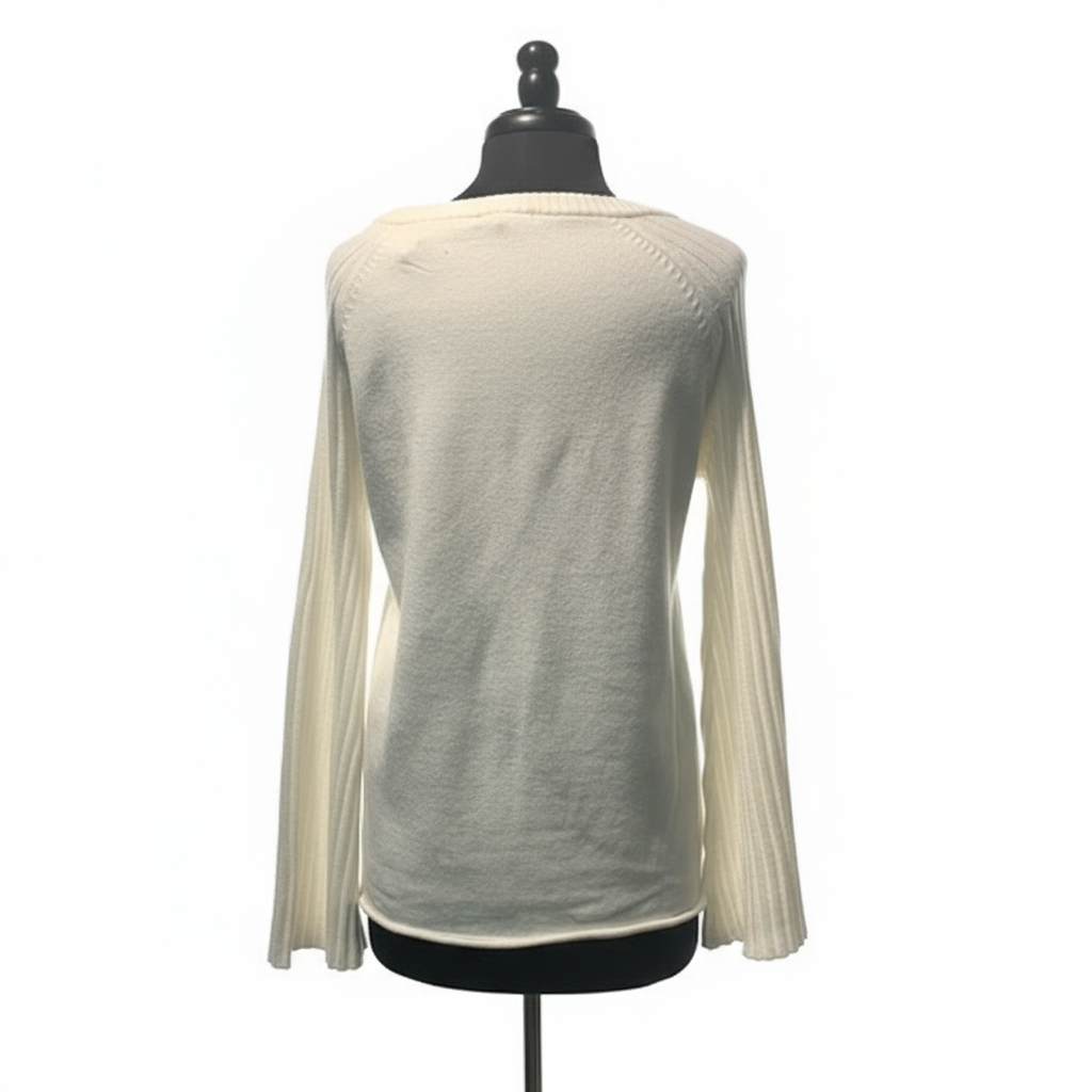 Back view of cream ribbed sweater showing bell sleeves and relaxed fit