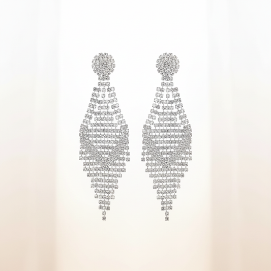 Light and elegant hero banner featuring diamond accent chandelier earrings with geometric lattice design on soft white background, highlighting 3.5-inch length and brilliant rhinestone sparkle