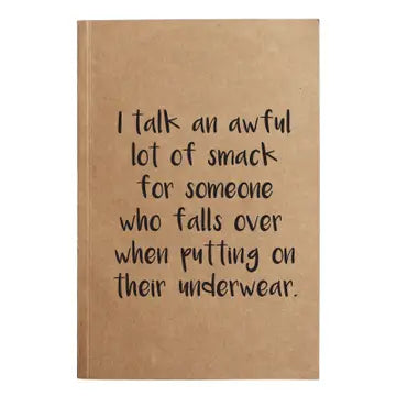 Kraft paper notebook with humorous text on a white background
