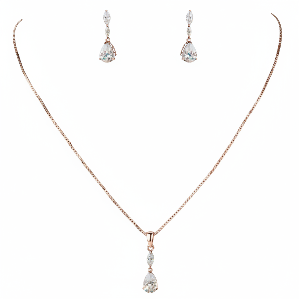 Rose gold necklace with teardrop pendant and matching earrings on a white background