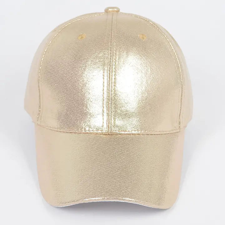 Gold metallic baseball cap on a white background