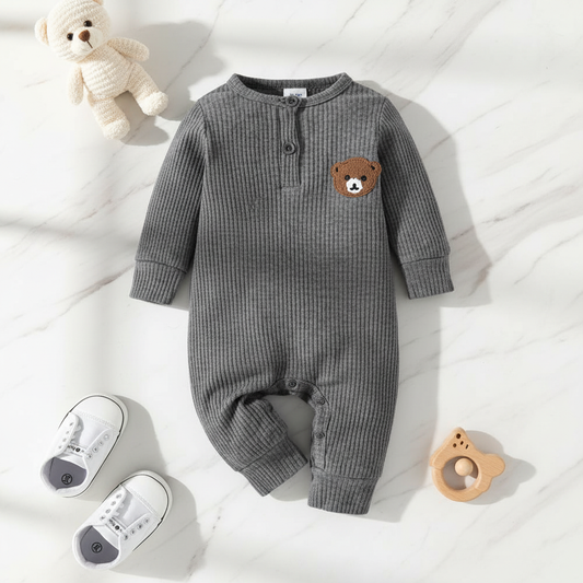 Flat lay of grey ribbed jumpsuit with bear patch