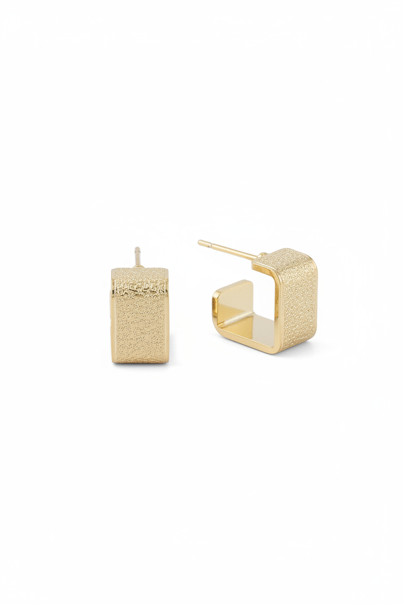Professional product photo of gold textured square open huggie earrings on pure white background showing 0.5-inch geometric design with textured finish