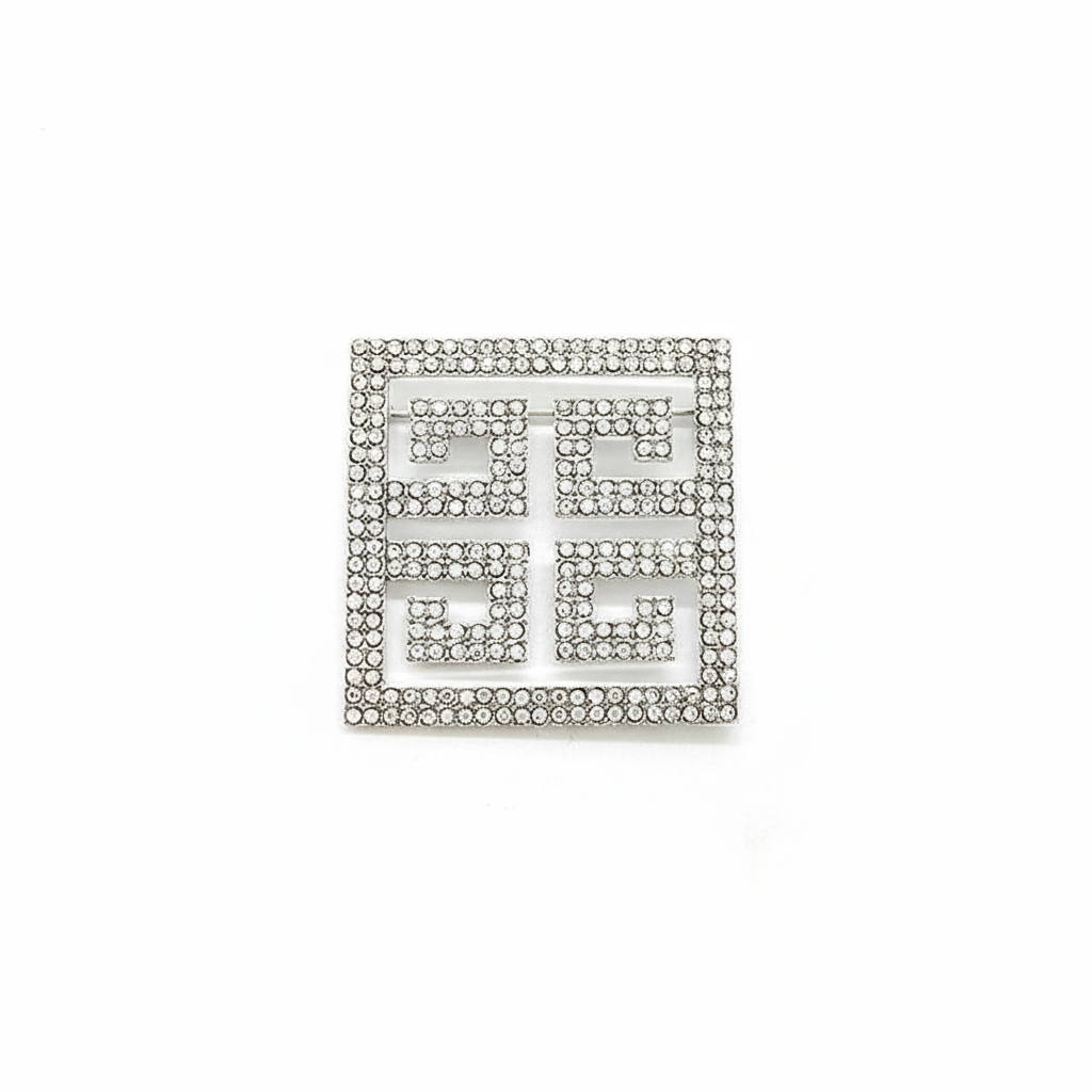 Silver Greek key rhinestone brooch with geometric meander pattern, 50mm square design with clear crystal embellishments on white background, premium jewelry product photography
