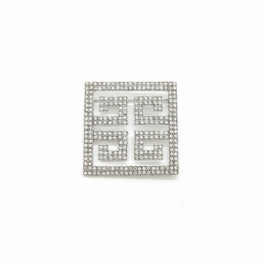 Silver Greek key rhinestone brooch with geometric meander pattern, 50mm square design with clear crystal embellishments on white background, premium jewelry product photography