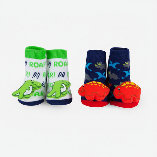 Hero image of both pairs of dinosaur rattle socks on white background