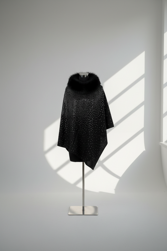  Black sparkle poncho with faux fur collar on mannequin with dramatic lighting - elegant winter wrap product photography