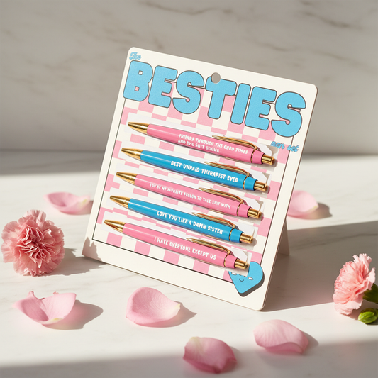 The Besties funny friendship pen set in retro pink and blue checkered packaging on white marble with pink flowers – BFF birthday Galentines gift under $20