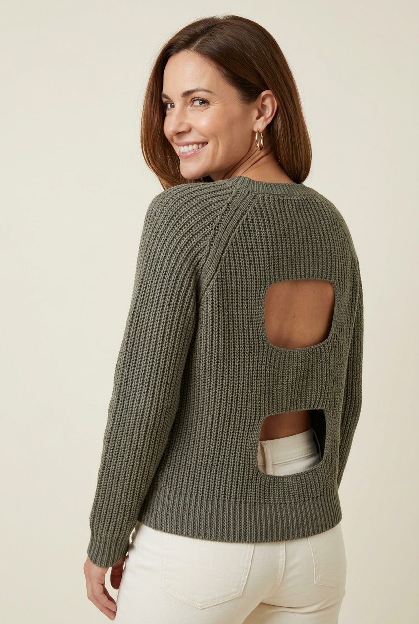 Olive double back-cutout knit sweater with long raglan sleeves, over-the-shoulder studio view styled with ivory jeans for weekend outfits.