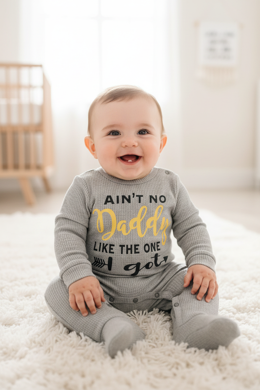 Smiling baby boy wearing grey Ain't No Daddy Like the One I Got waffle knit jumpsuit, Father's Day baby outfit