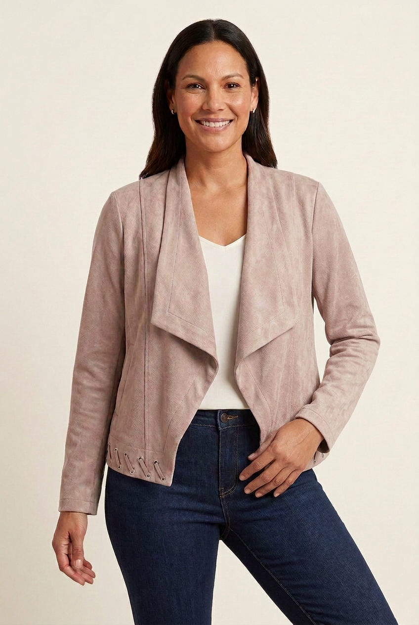 Blush faux suede waterfall jacket with diagonal laced hem in a relaxed front pose, styled with an ivory camisole and dark denim.