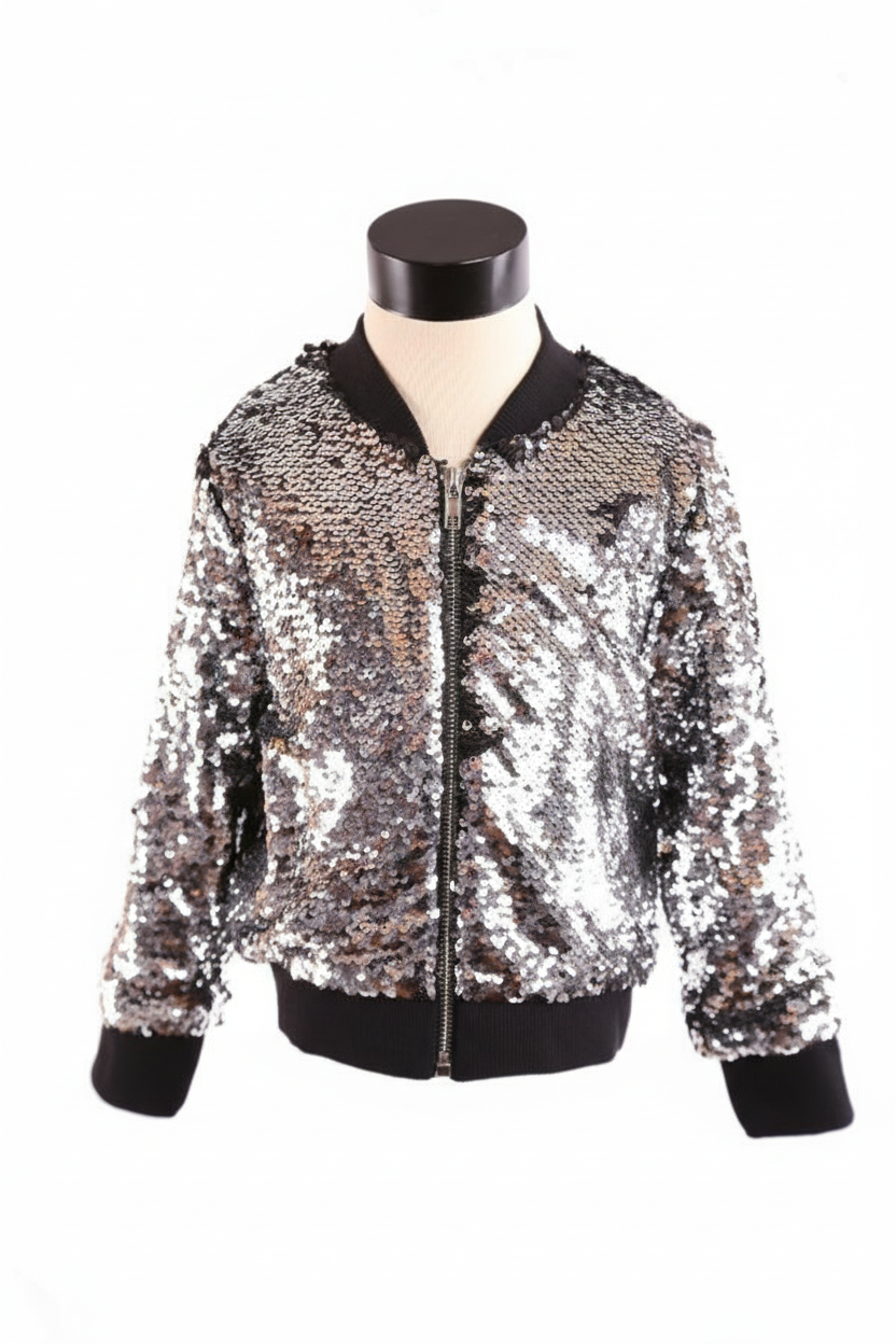 Girls' silver sequin bomber jacket with black ribbed trim displayed on dress form against white background, professional studio lighting