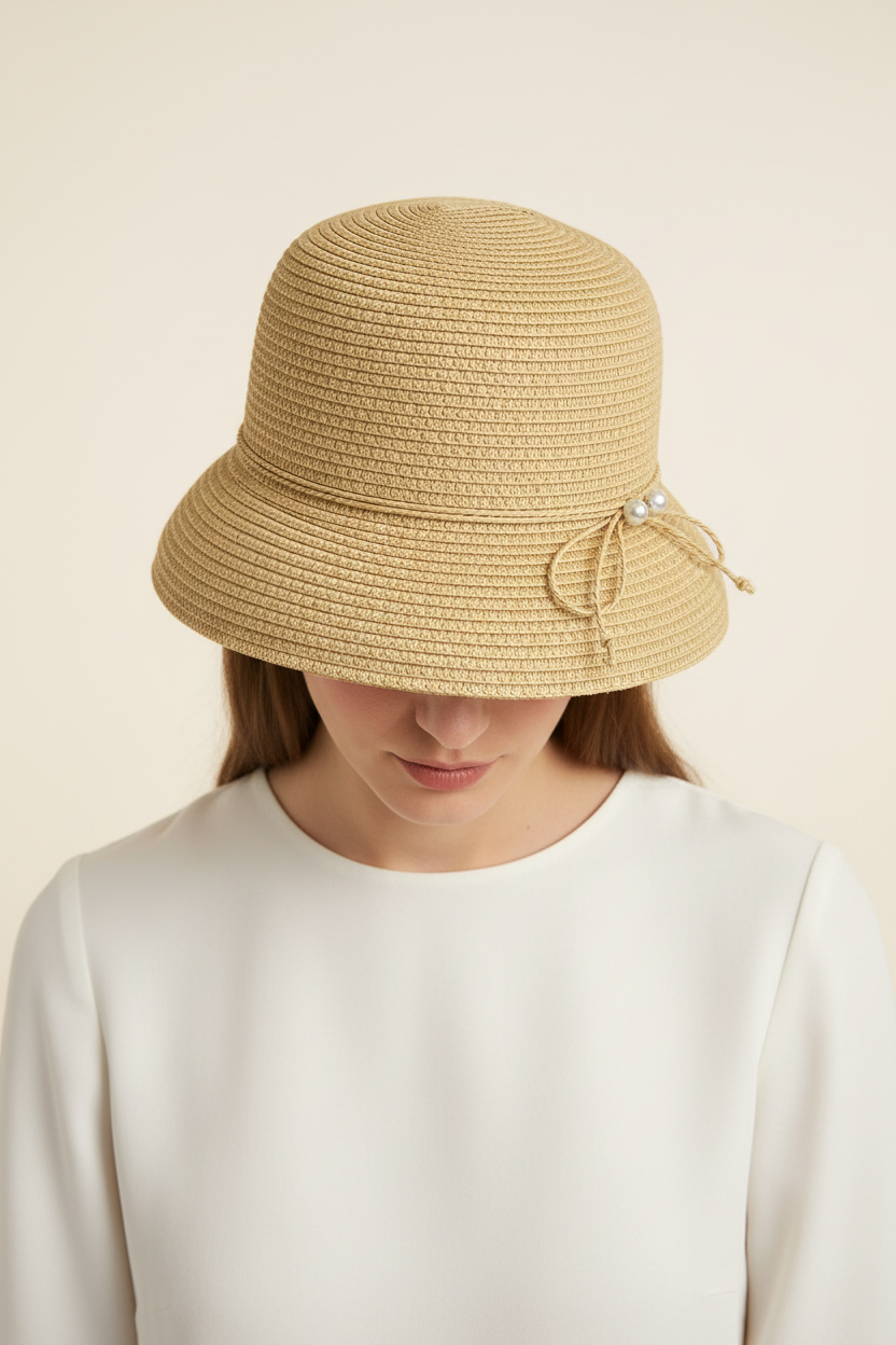 John Callanan paper braid sun hat editorial view showing spiral crown weave detail on model