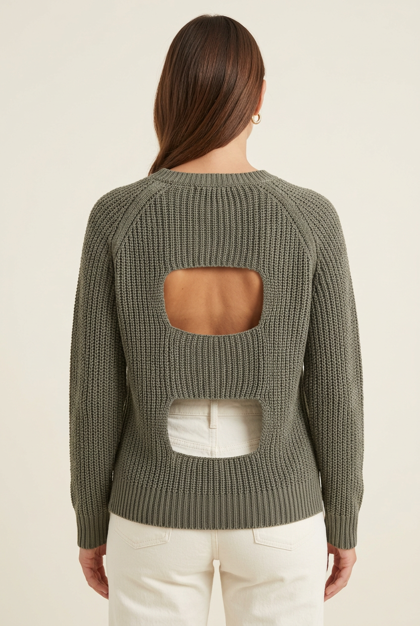 Olive raglan knit sweater showing two stacked back cutouts and ribbed trim, studio back view styled with ivory jeans for casual dinners.