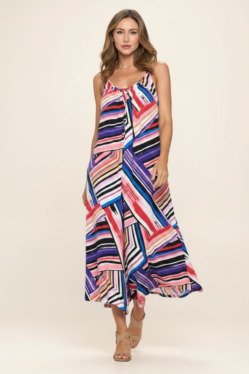 Abstract geometric jumpsuit movement shot – ReneeC wide-leg flowy jumpsuit coral pink blue print walking