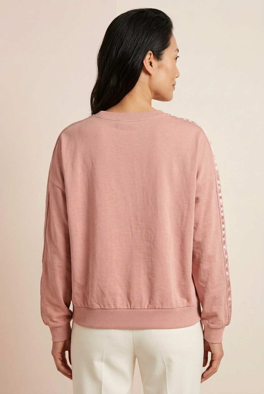 Back view of blush lightweight drop-shoulder pullover with plain shoulders, satin sleeve stripes and ribbed hem