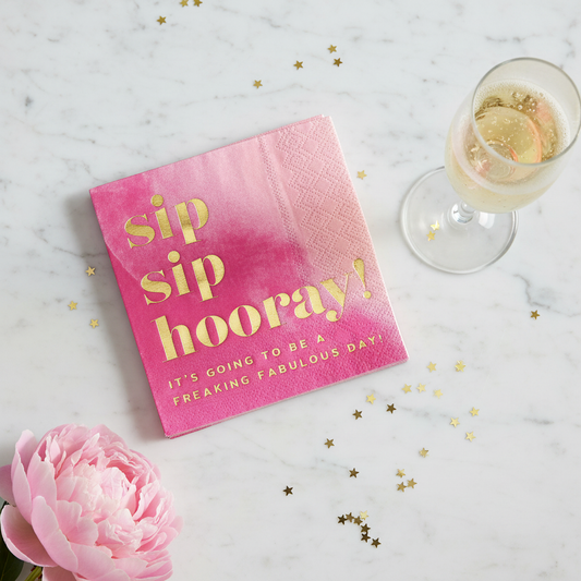 Sip Sip Hooray hot pink gold foil cocktail napkins on white marble with champagne flute gold confetti and pink peony – birthday bachelorette party napkins