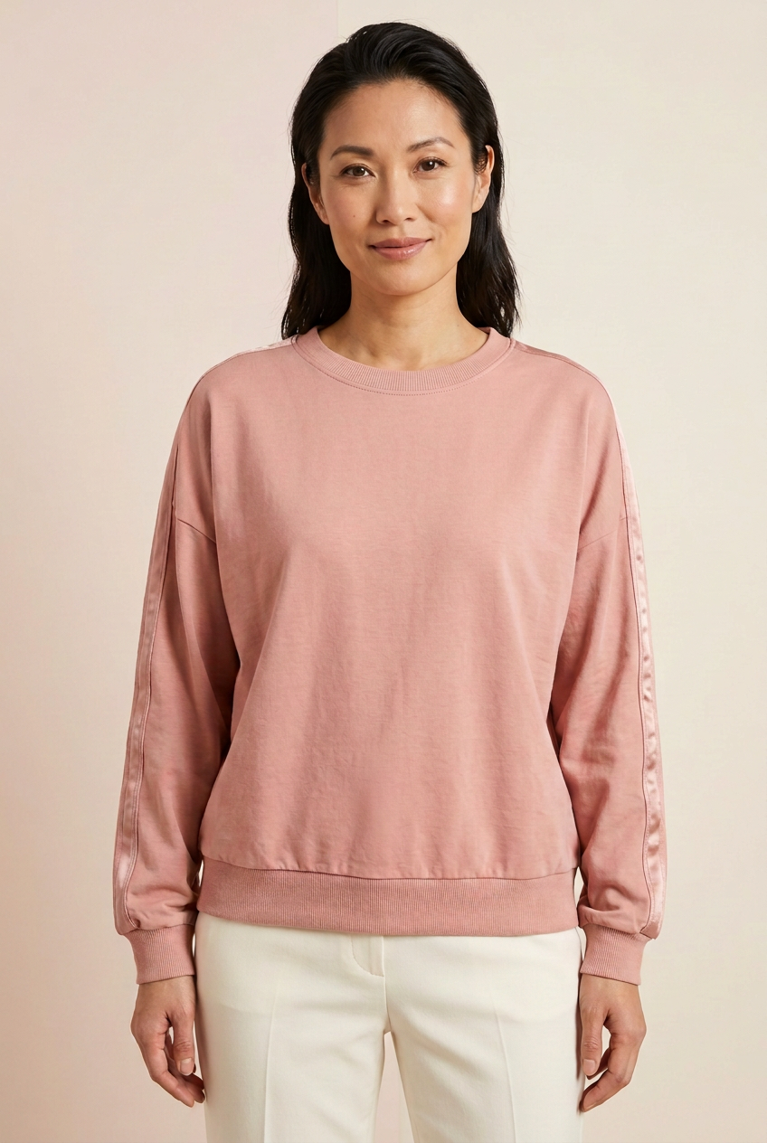 Blush lightweight drop-shoulder pullover with satin sleeve stripes beginning at the upper-arm seams, front view