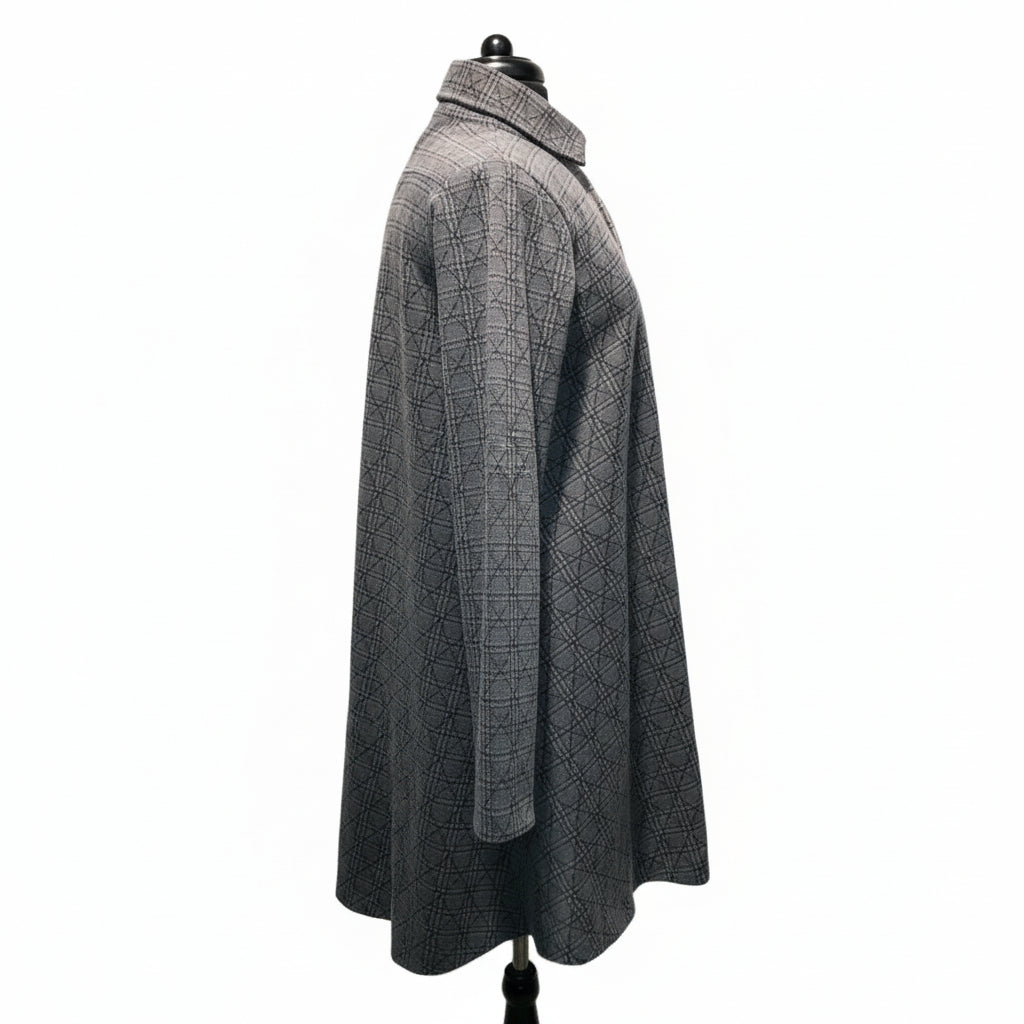 Grey plaid coat side view showing hi-low hemline, relaxed silhouette, and intricate check pattern texture