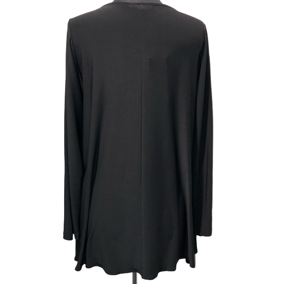 Back view of black statement pocket tunic on dress form showing clean solid black design and relaxed silhouette