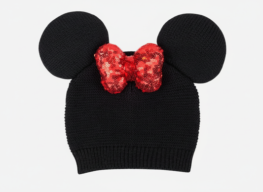 Black knit Minnie Mouse beanie with 3D ears and red sequin bow on white background
