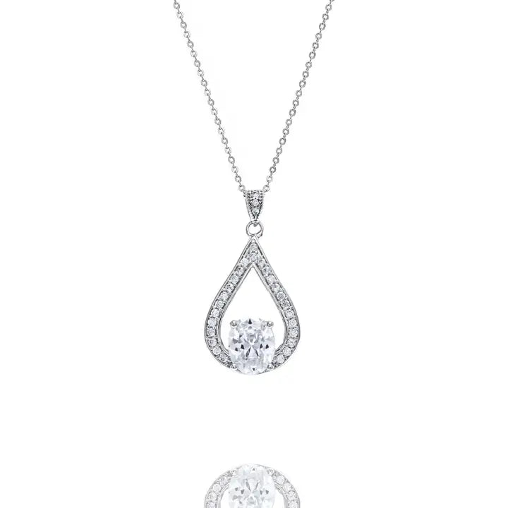 Teardrop pendant necklace with cubic zirconia halo and center stone on silver chain against white background