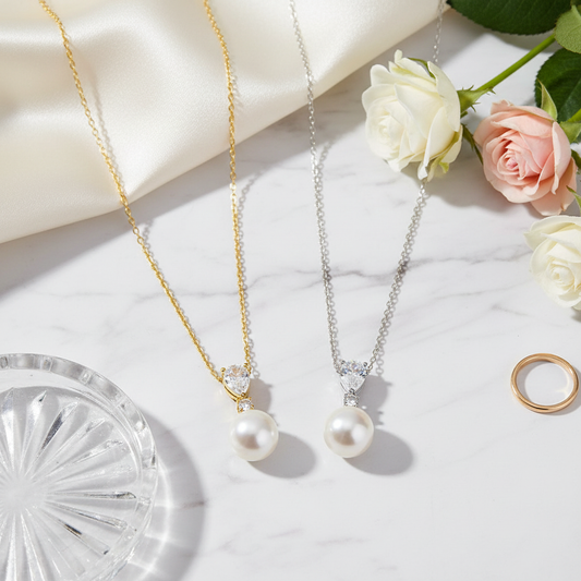 Flat lay of pearl pendant necklaces