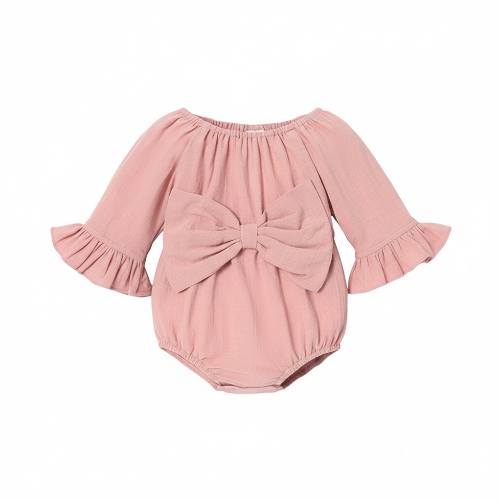 Baby girl pink onesie with ruffle sleeves and large bow on white background