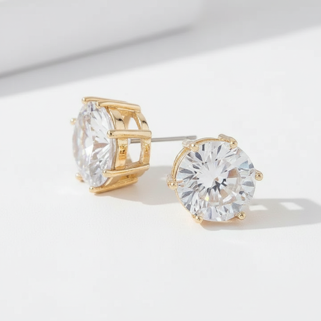 Round crystal CZ stud earrings in gold - side view showing prong setting and sparkle

