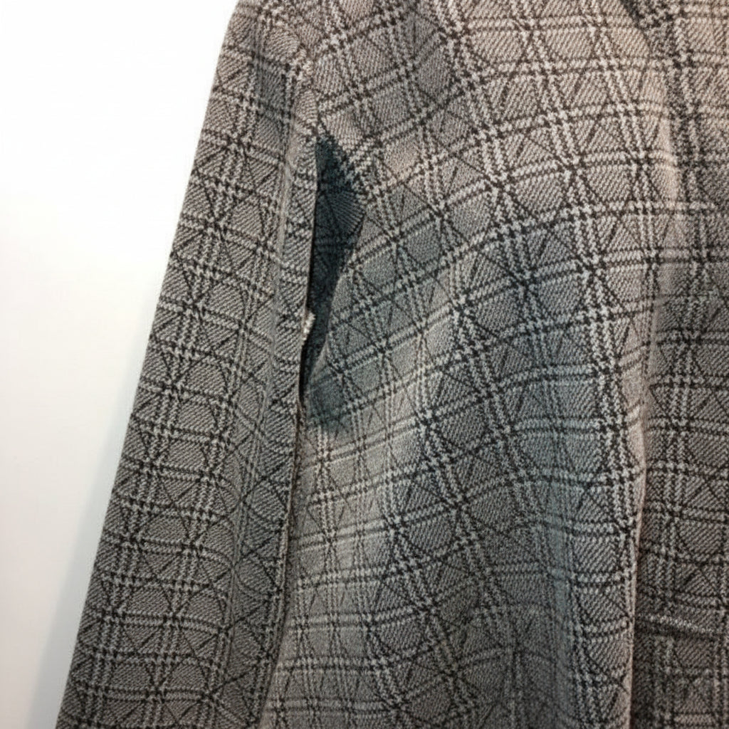 Close-up detail of grey plaid fabric texture and pattern