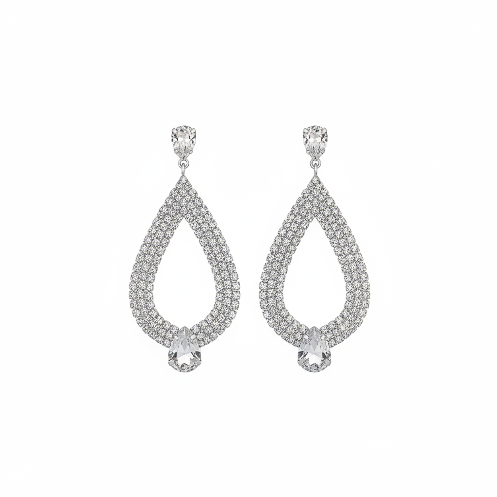 Silver rhinestone teardrop dangle earrings with crystal pavé and pear-shaped drop on white background