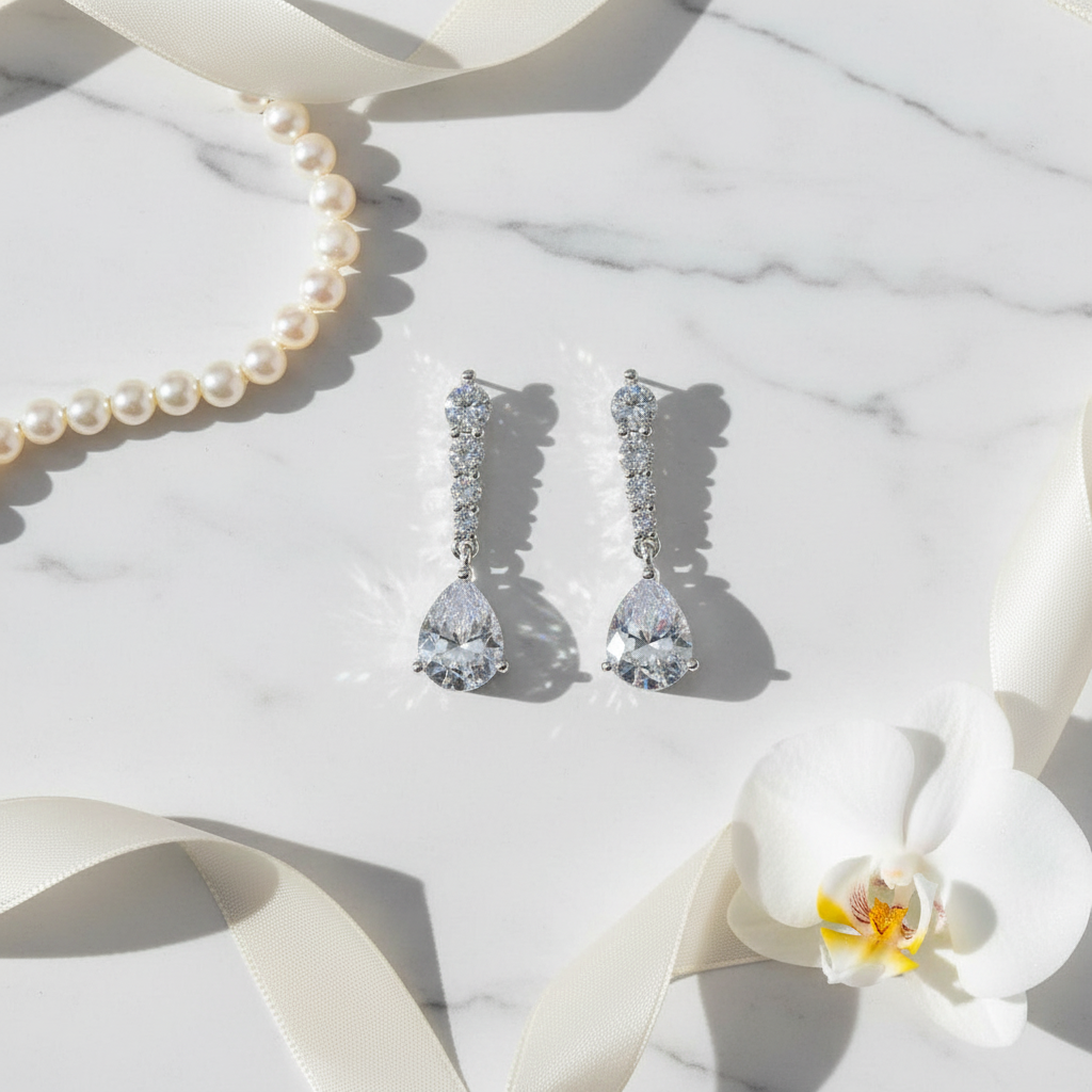 Teardrop cubic zirconia drop earrings flat lay